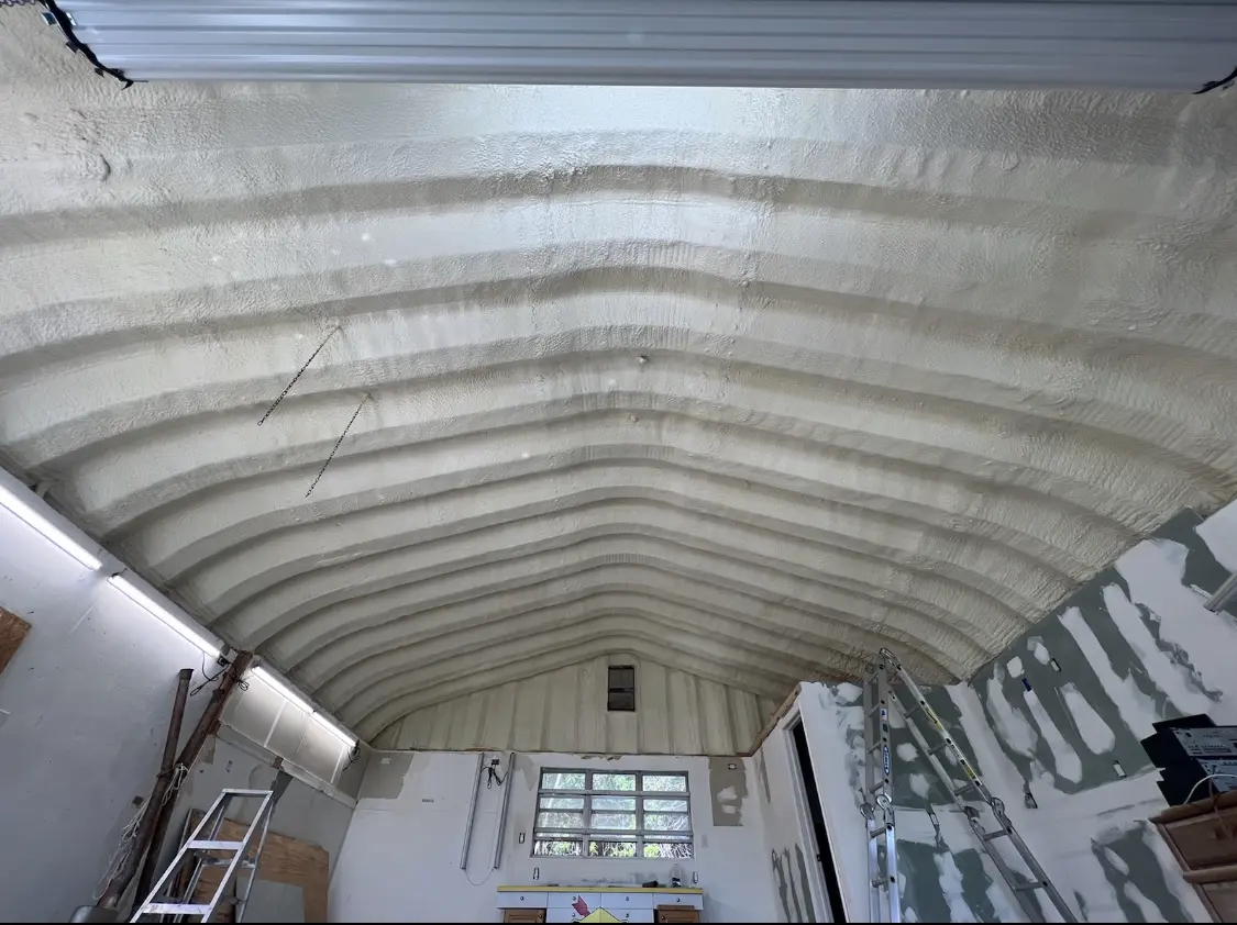 Spray polyurethane foam applied to the underside of a metal roof deck in Port Royal